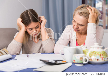 mother and her adult daughter with financial problems mother and her adult daughter with financial problems 72806881