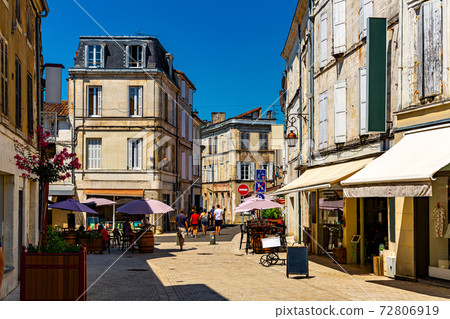 Typical narrow street in Cognac Old Town in summer, France Typical narrow street in Cognac Old Town in summer, France 72806919