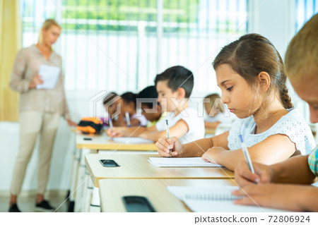 Group of focused kids working at class Group of focused kids working at class 72806924