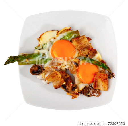 Fried eggs with mushrooms, bacon and asparagus for breakfast 72807650