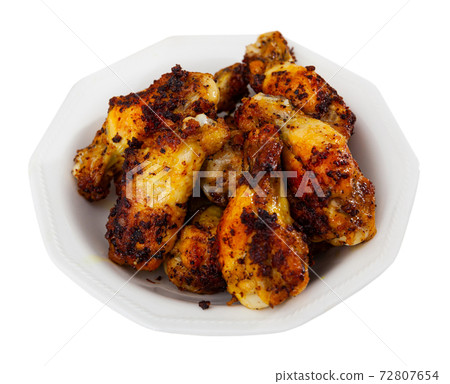 Crispy deep fried chicken wings served on plate Crispy deep fried chicken wings served on plate 72807654