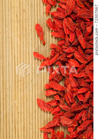 Goji berries on wooden surface Goji berries on wooden surface 72807667