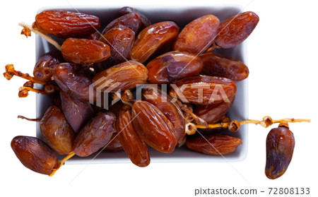 Fresh dates on white background, healthy snack 72808133