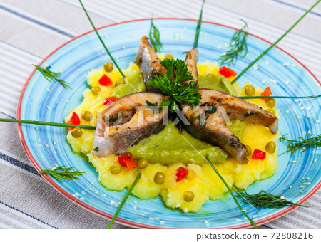 Trout steaks served with potato puree Trout steaks served with potato puree 72808216