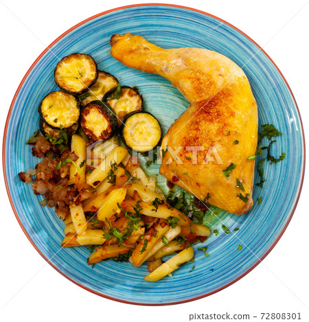 Chicken legs with fried potato and zucchini Chicken legs with fried potato and zucchini 72808301