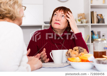 Old women in the kitchen quarrel 72808456