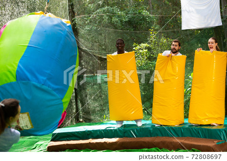 People as bowling pins in an amusement park on a summer sunny day 72808697