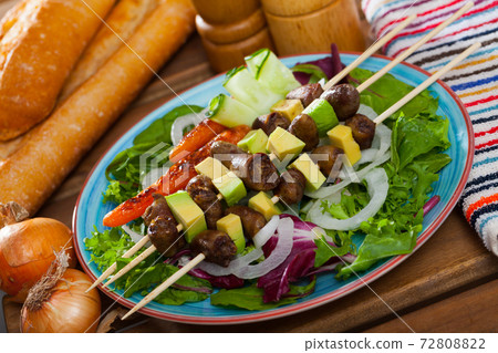 Grilled chicken hearts on skewers Grilled chicken hearts on skewers 72808822