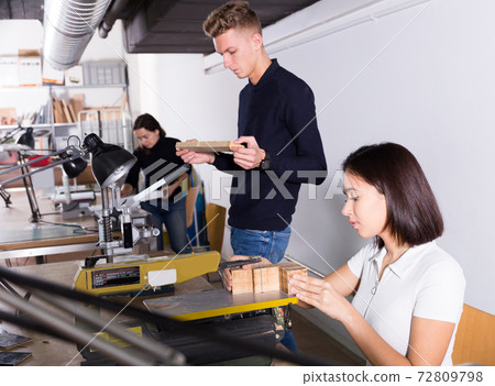 Young architects creating architectural model Young architects creating architectural model 72809798