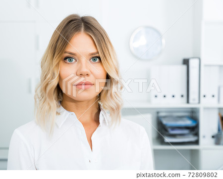 Kindness girl in white shirt in modern office close-up 72809802