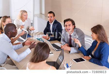 Business team having emotional discussion Business team having emotional discussion 72809813