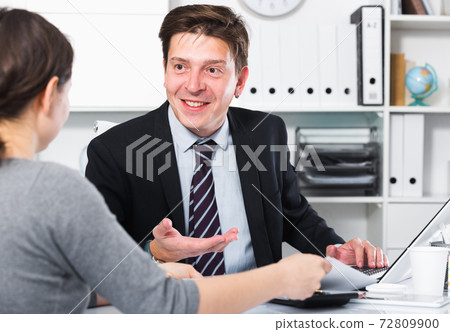 Young smiling man with companion Young smiling man with companion 72809900