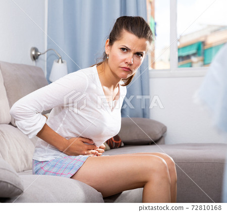 Woman with stomachache Woman with stomachache 72810168