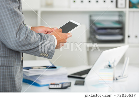 Male testing modern middle size touchpad Male testing modern middle size touchpad 72810637