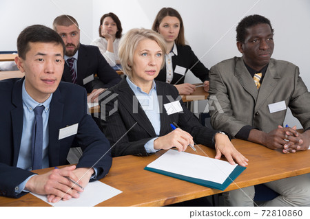 People during business seminar in lecture hall 72810860