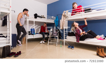 Tourists staying in cozy hostel Tourists staying in cozy hostel 72811080