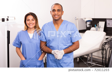 Two smiling beauticians in clinic of esthetic medicine 72811203