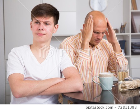 Man and his son offended at each other Man and his son offended at each other 72811398