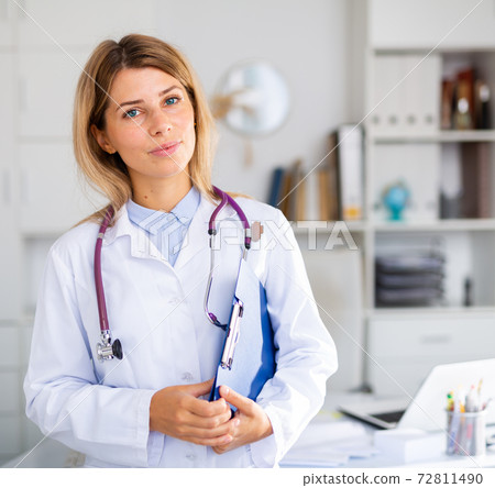 adult doctor female working in uniform in room adult doctor female working in uniform in room 72811490