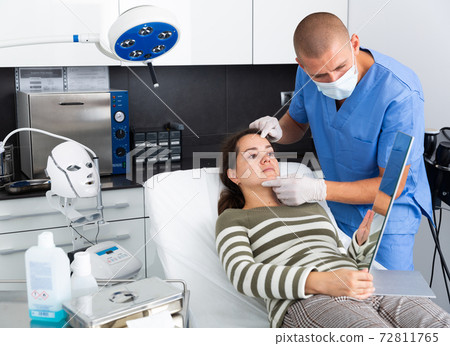 Woman having consultation with doctor in clinic Woman having consultation with doctor in clinic 72811765