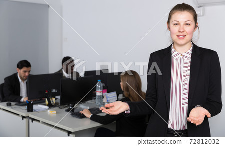 Businesswoman welcoming to office 72812032
