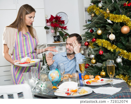 Woman cleaning table after dinner 72812074