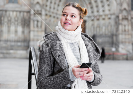 girl using mobile phone in scarf girl using mobile phone in scarf 72812340