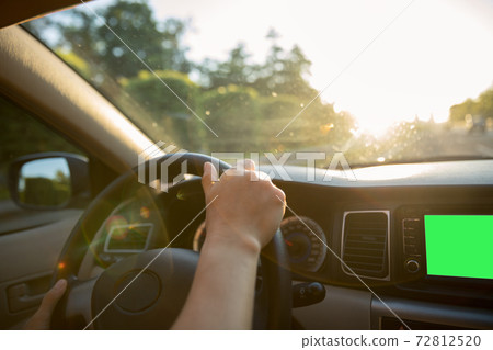 Driving car on sunrise highway Driving car on sunrise highway 72812520
