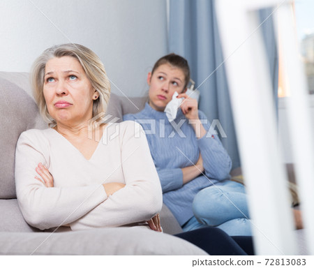 Woman and daughter offended at each other Woman and daughter offended at each other 72813083