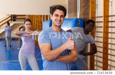 Smiling man posing in fitness club Smiling man posing in fitness club 72813639