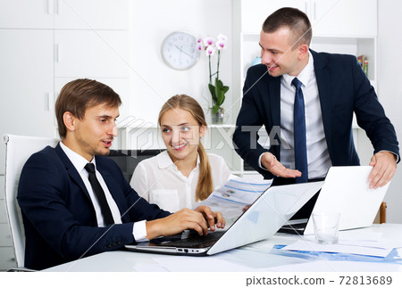 Business colleagues with document in hands Business colleagues with document in hands 72813689