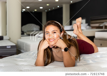 Ordinary latin american woman lying on bed Ordinary latin american woman lying on bed 72813748