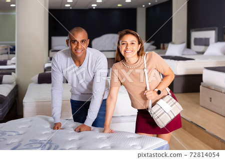 Nice young couple looking for new mattress Nice young couple looking for new mattress 72814054