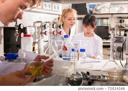 Chinese female student noting results Chinese female student noting results 72814166