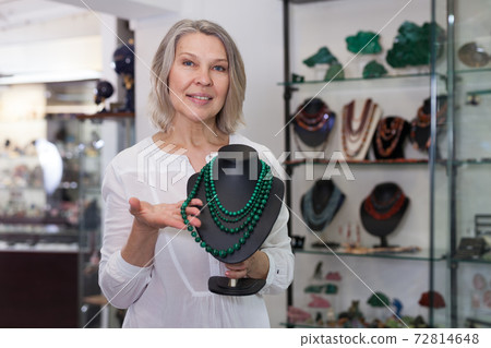Jewelry store seller offers to buy malachite necklace Jewelry store seller offers to buy malachite necklace 72814648
