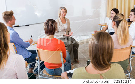 Students listening to lecture of female teacher Students listening to lecture of female teacher 72815214