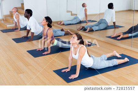 Group yoga class in modern gym Group yoga class in modern gym 72815557