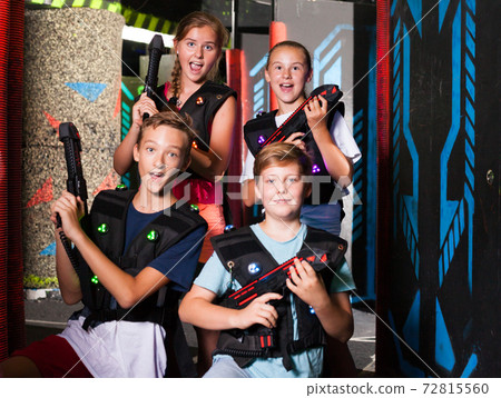 Girls and boys posing with laser pistols 72815560