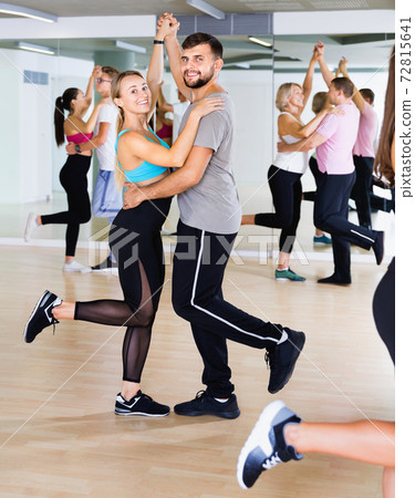 Group of young adults dancing salsa in club 72815641