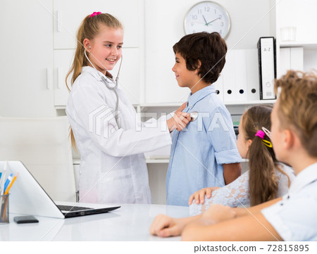 Nurse girl in medical center with stethoscope Nurse girl in medical center with stethoscope 72815895