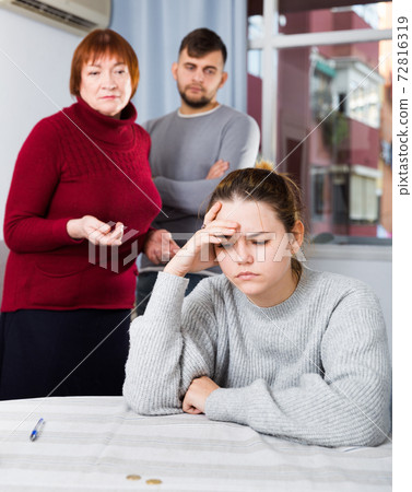 Frustrated girl having problems in relationship with family 72816319