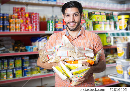 customer who is standing with purchases 72816405