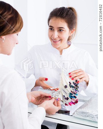 Woman doing manicure 72816482