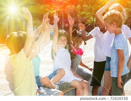 Happy kids playing on summer city street Happy kids playing on summer city street 72816530