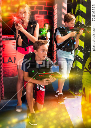 Girls and boys playing laser tag 72816813