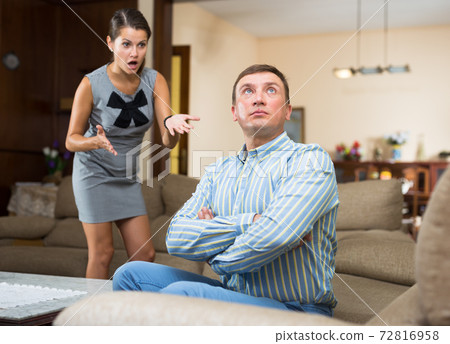 Male and female quarreling at home Male and female quarreling at home 72816958