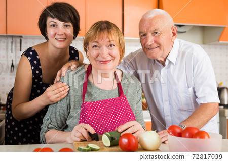 Elderly man and woman and their daughter 72817039