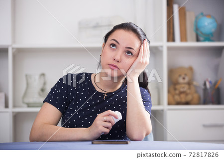 Sad girl waiting for phone call 72817826