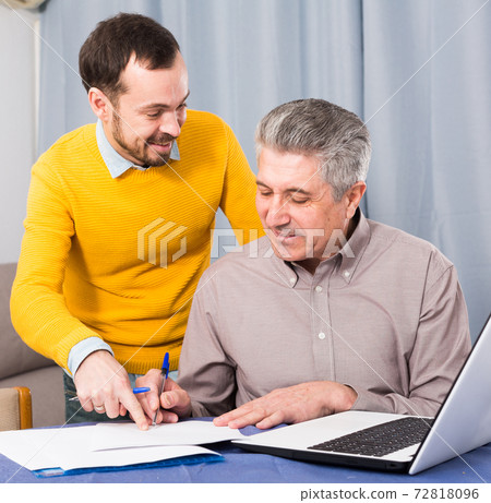 Man and sales manager discuss contract 72818096