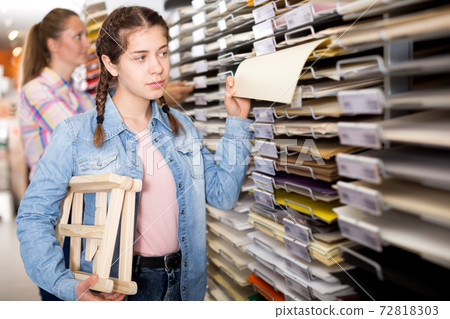 Smiling girl shopping multicolored paper Smiling girl shopping multicolored paper 72818303